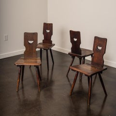 A Set of Four Brutalist Dining Chairs in the style of Torck