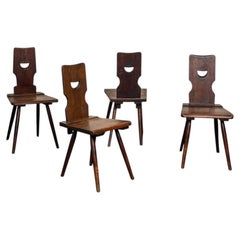 A Set of Four Brutalist Dining Chairs in the style of Torck