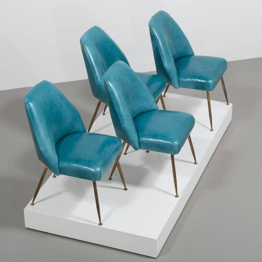 A Sensational Set of Four Teal Leather Upholstered Chairs designed Carlo Pagani Campanula Chairs for Arflex 1952 
This set has had their upholstery entirely rebuilt and reupholstered by our company in a rich teal leather finished with brass