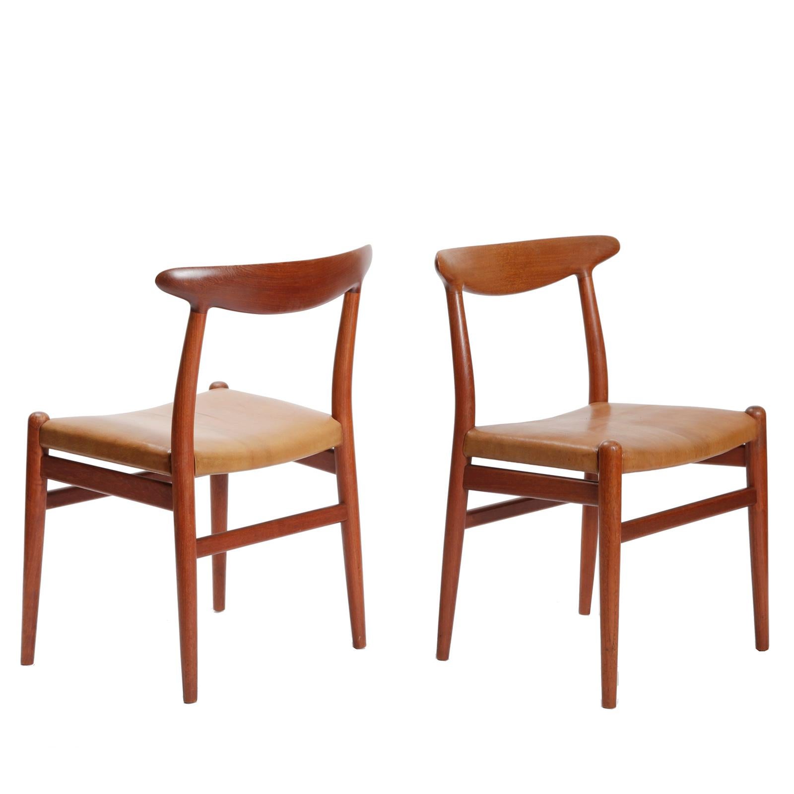 A set of four dining chairs, model W2, in teak with seat recovered in Niger goatskin.
Designed by Hans Wegner in 1950 and beautifully crafted by cabinetmaker C.M. Madsen, Denmark.