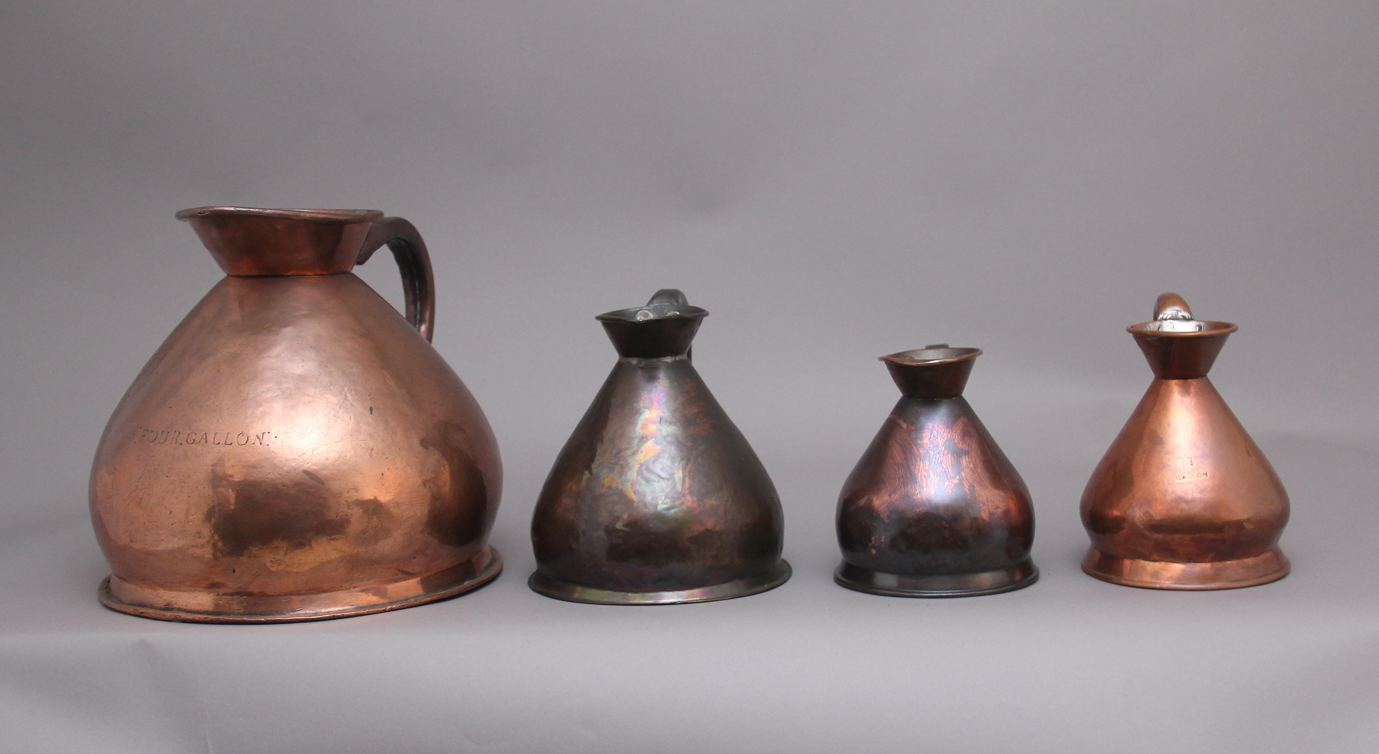 British Set of Four Decorative 19th Century Copper Measuring Jugs For Sale