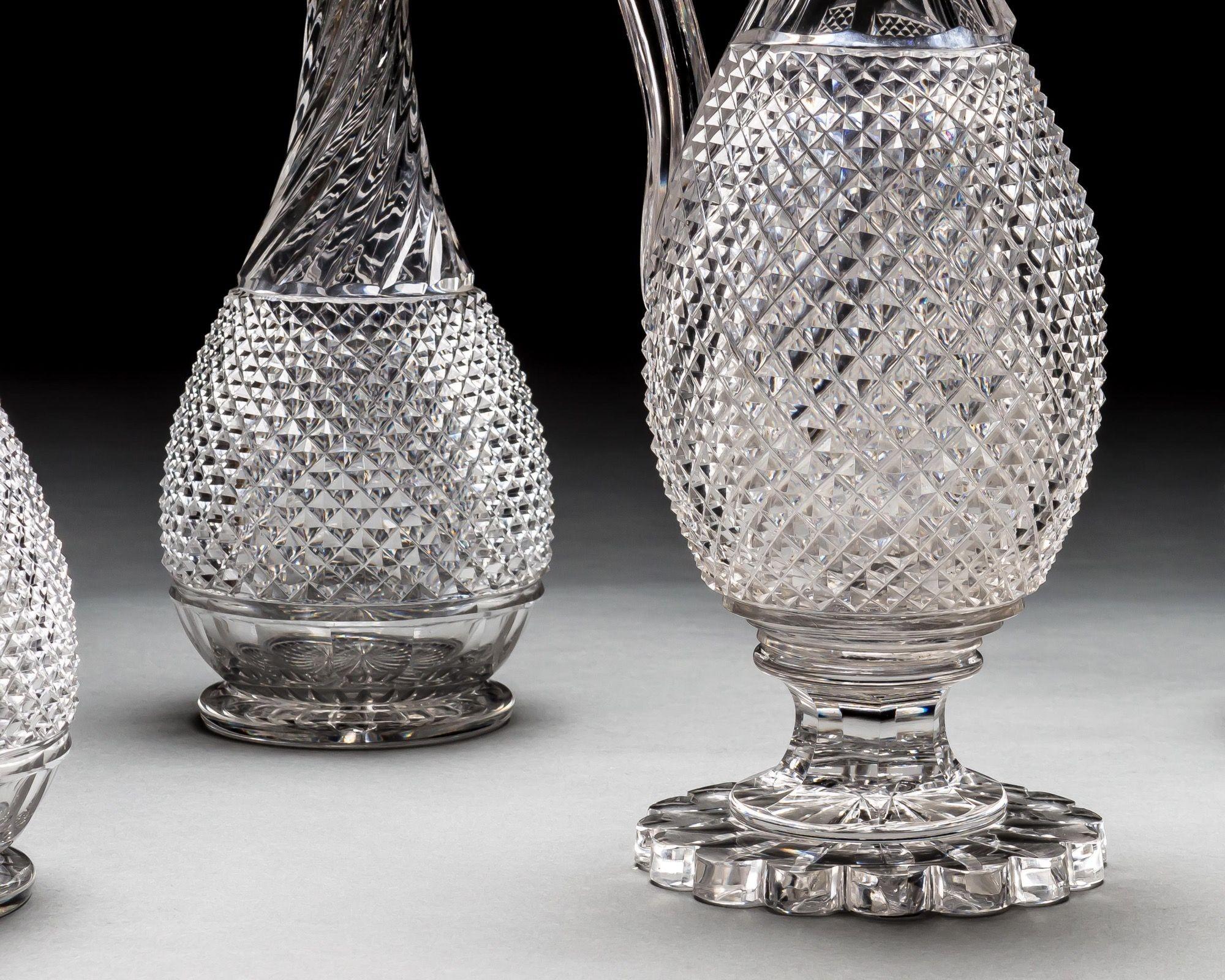 A set of four diamond and swirl cut Victorian decanters with diamond ball stoppers, along with matching wine ewer.
Ewer Dimensions:
Height - 34cm
Width - 16.5cm