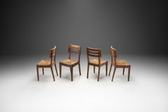 Juego de cuatro sillas de comedor con asientos tejidos de Pierre Cruège, Francia, ca. 1950