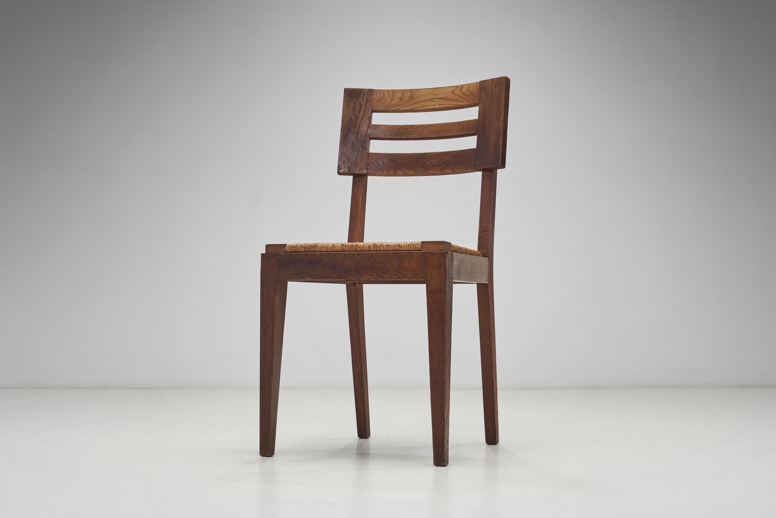 Jonc Ensemble de quatre chaises de salle à manger à assise tissée par Pierre Cruège, France, vers les années 1950