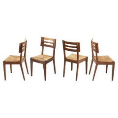 Juego de cuatro sillas de comedor con asientos tejidos de Pierre Cruège, Francia, ca. 1950
