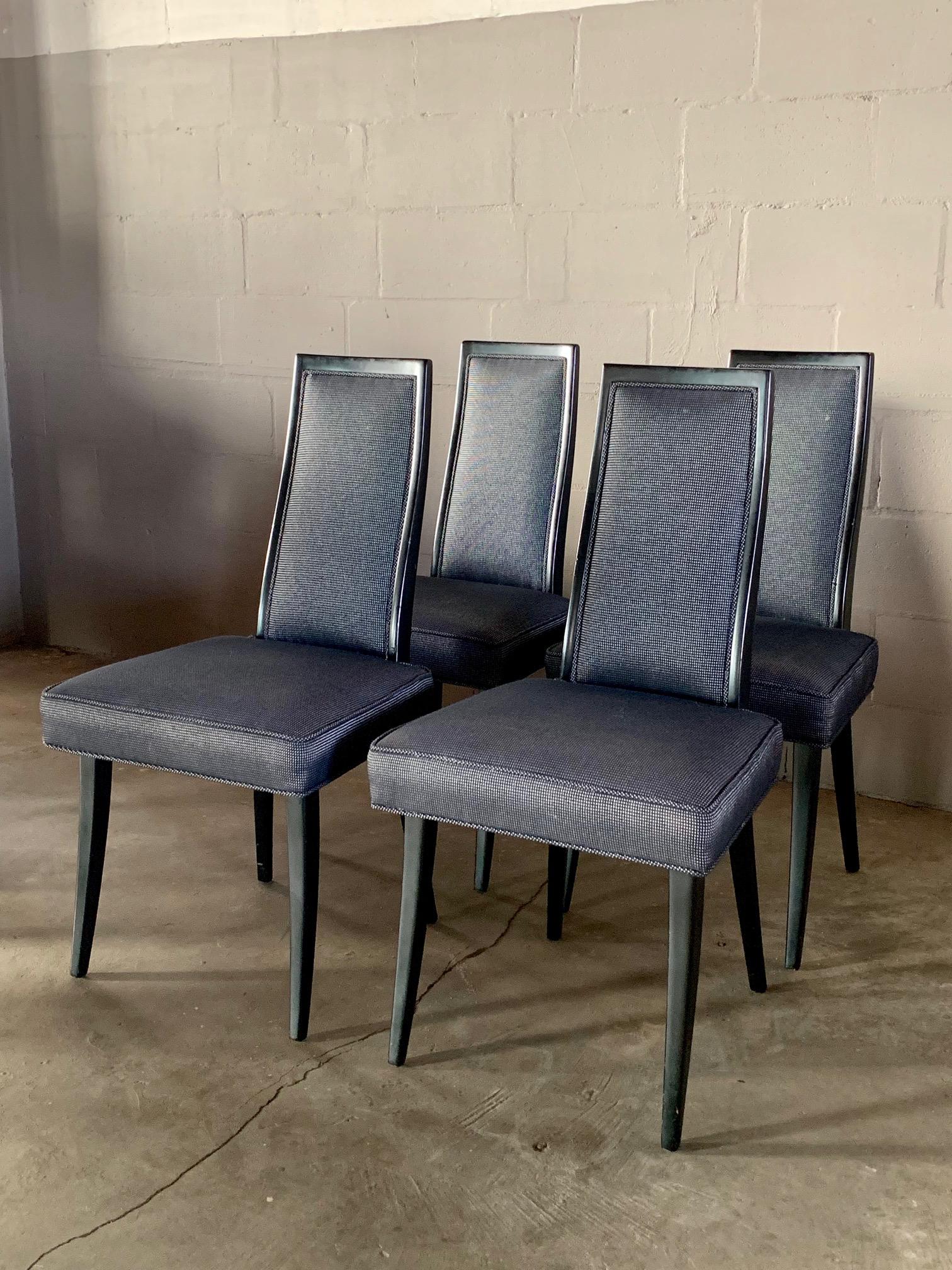 A set of elegant, high back dining chairs by Harvey Probber. Finished in black lacquer.