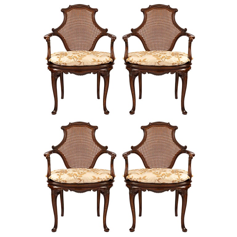 Set of Four English 19th Century Dark Oak Cane Armchairs For Sale at