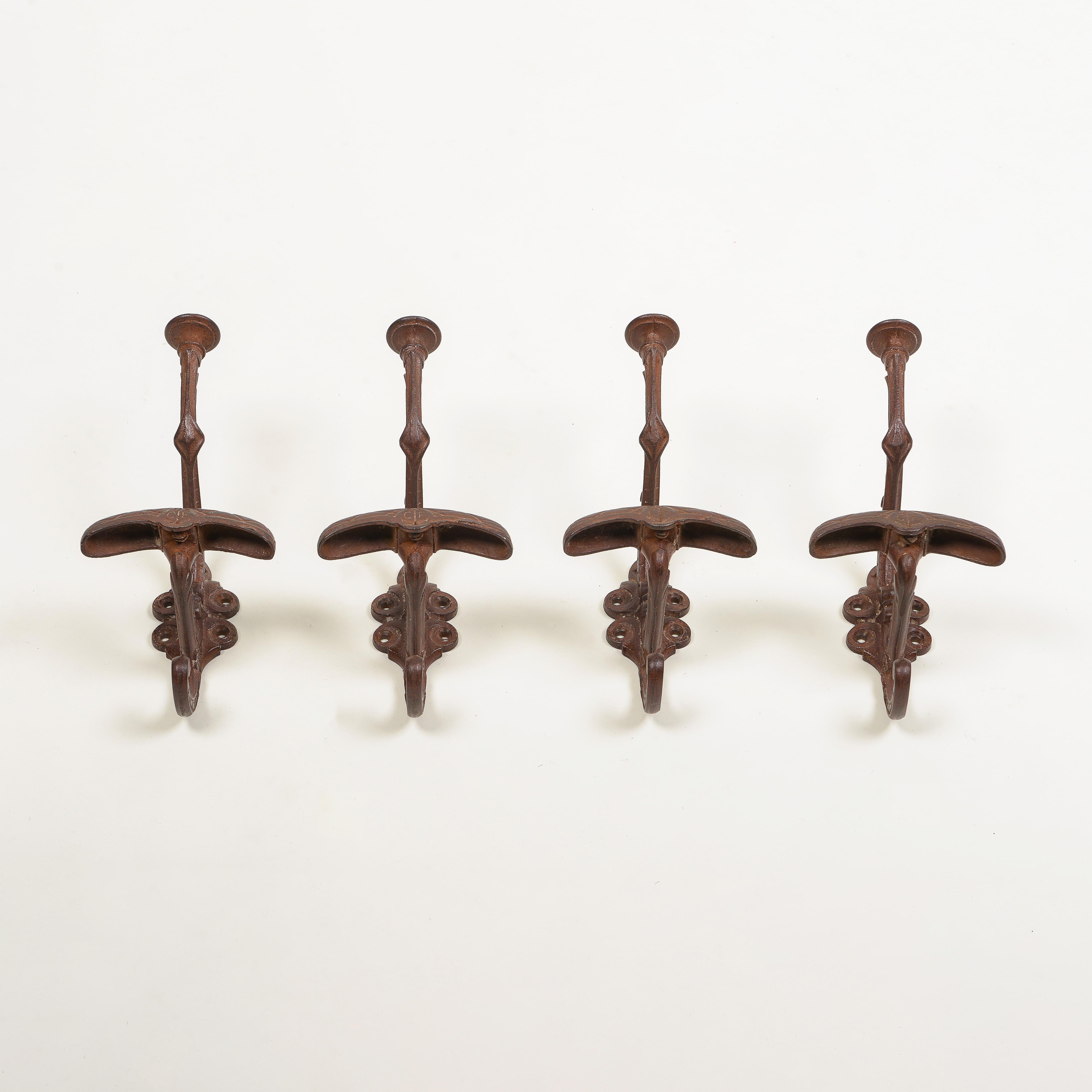 Art Nouveau Set of Four English Cast Iron Hat and Coat Hooks