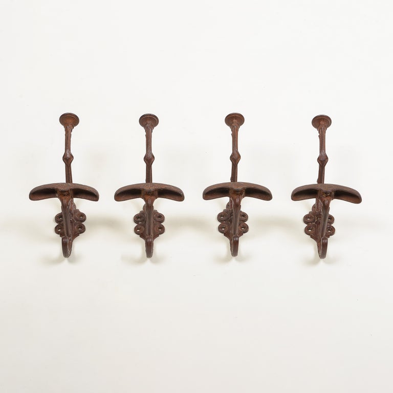 Art Nouveau Set of Four English Cast Iron Hat and Coat Hooks