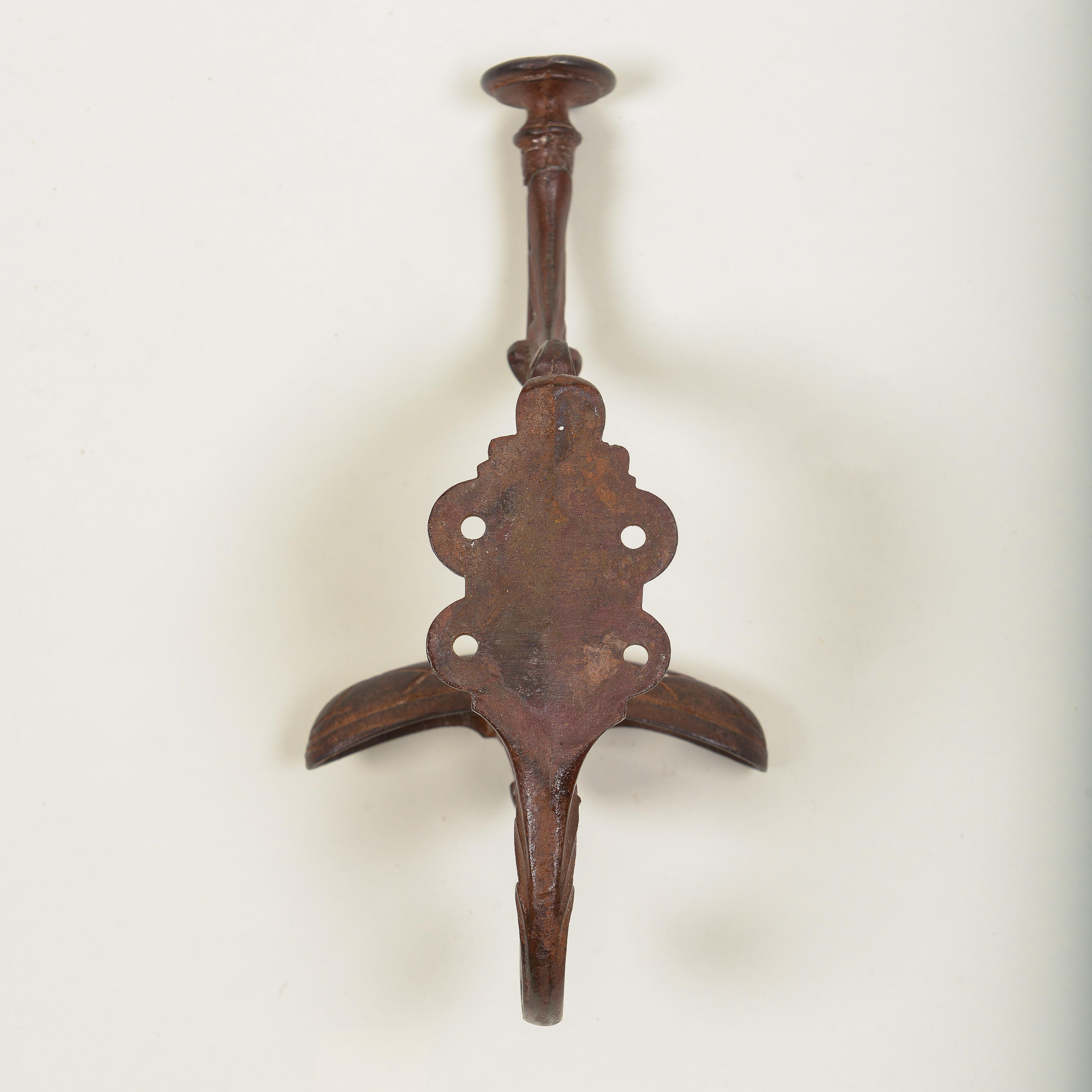 Early 20th Century Set of Four English Cast Iron Hat and Coat Hooks