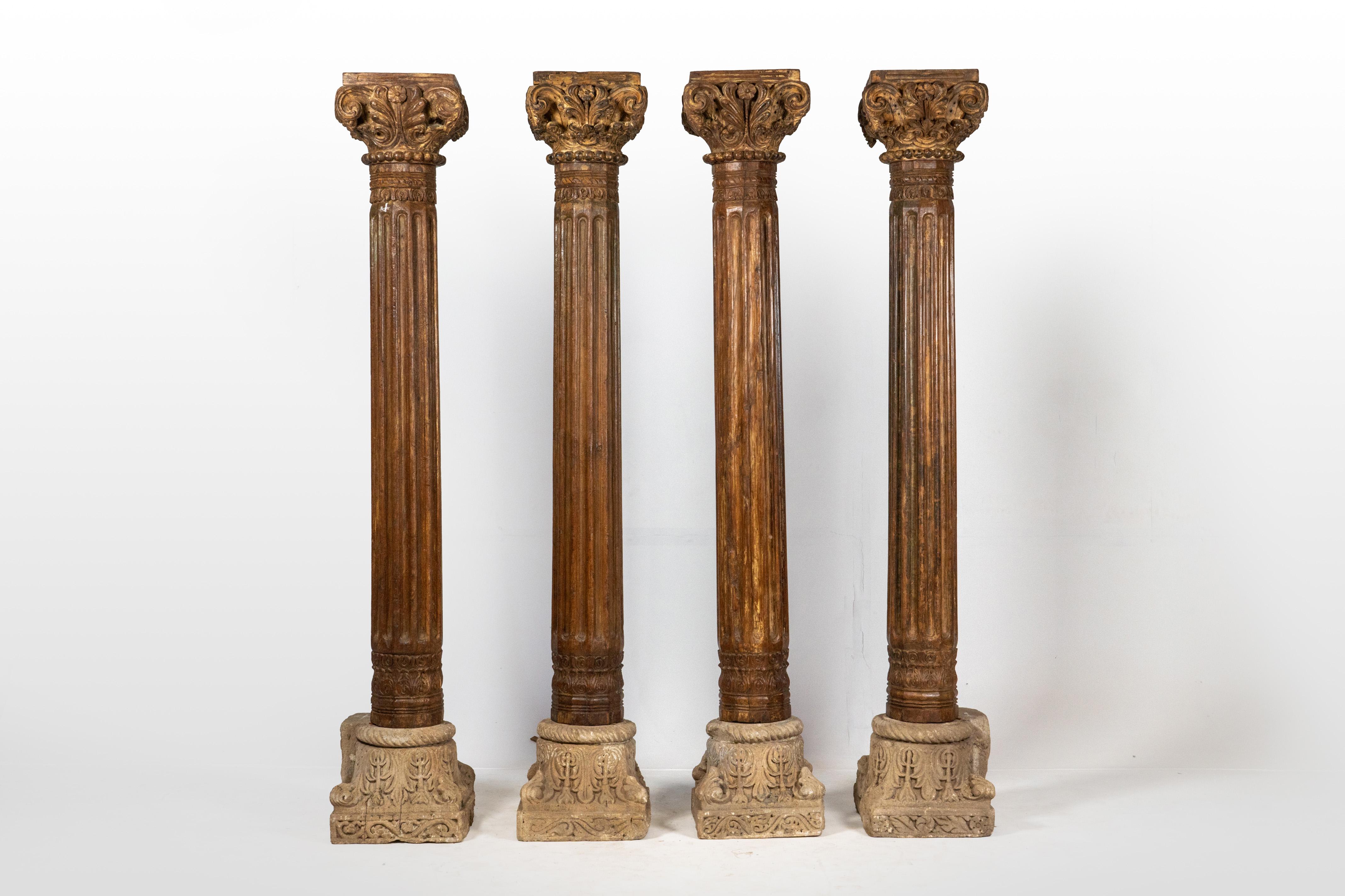 This set of four European Inspired columns exemplifies a fusion of British, Greek, and Indian design influences, the capital is meticulously crafted in the Corinthian order. Adorned with acanthus leaves, pomegranate flowers symbolizing fertility and