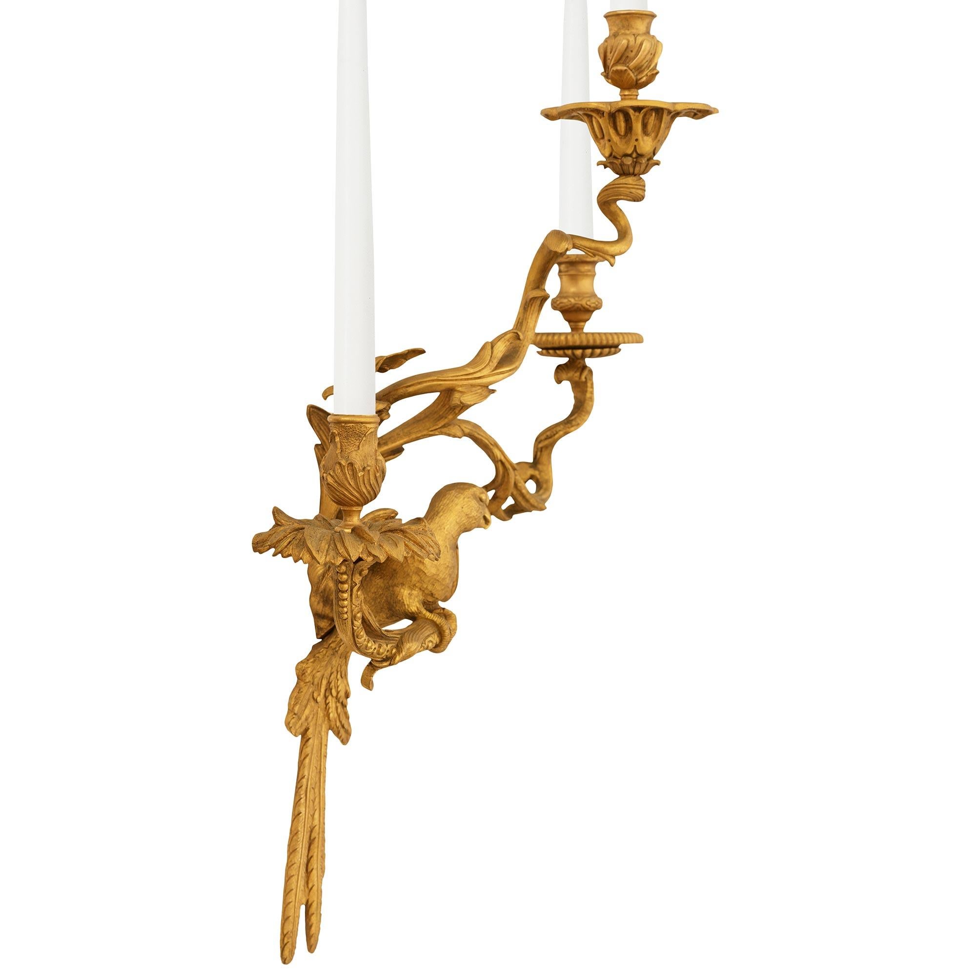 A set of four French 19th century Louis XV st. Ormolu Parrot sconces In Good Condition For Sale In West Palm Beach, FL