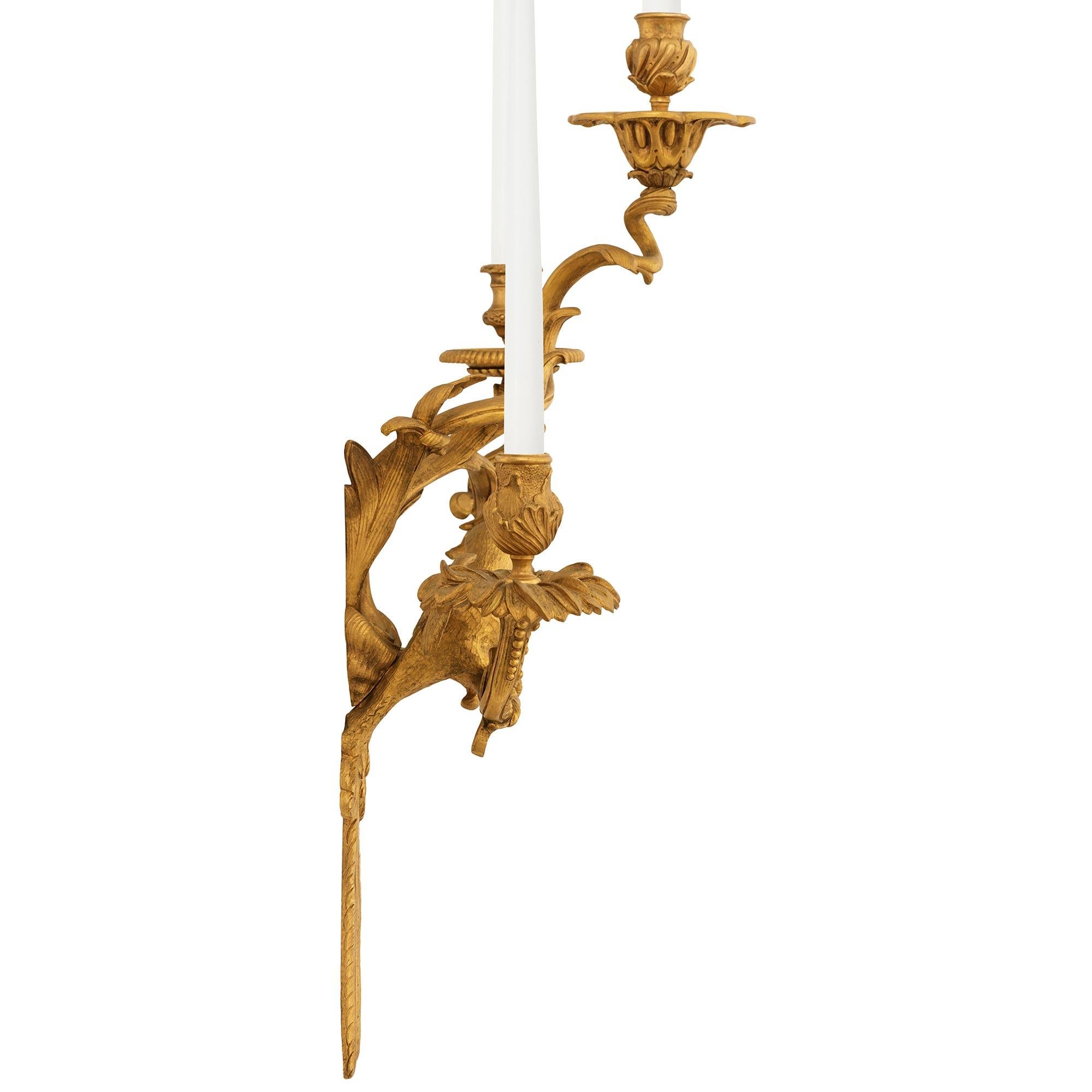 19th Century A set of four French 19th century Louis XV st. Ormolu Parrot sconces For Sale