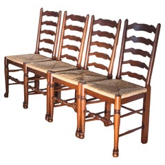 Retro A set of four French Country ladderback wicker rush chairs, mid 20th c