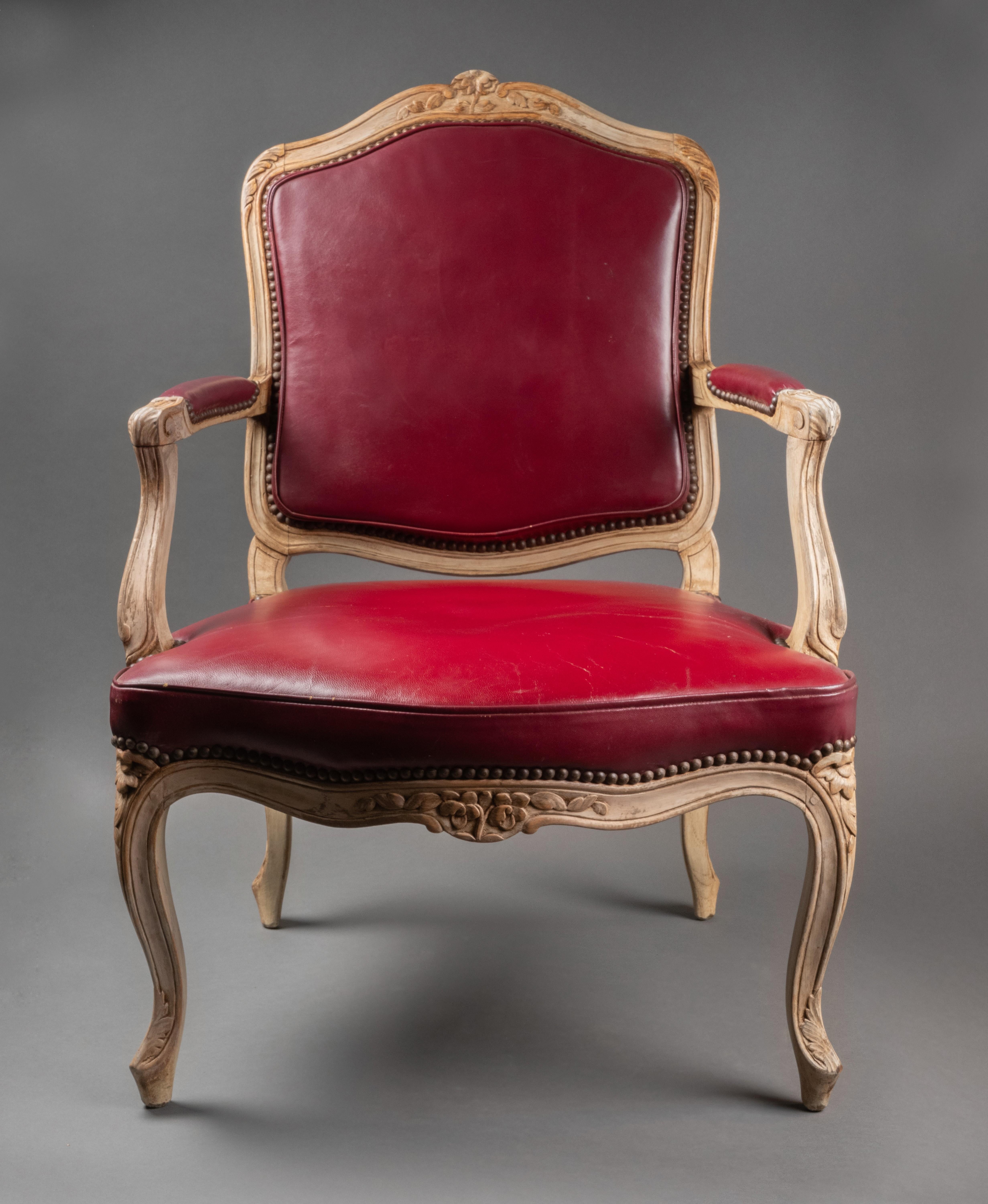 A suite of four Louis XV lacquered woord armchairs  circa 1750
Ornated with flowers and leaves, with a red leather upholstery.
18th century, Paris, France
Size: height 36.61 inches, width: 25.59 inches, depth: 20.47 inches (93x65x52 cm)