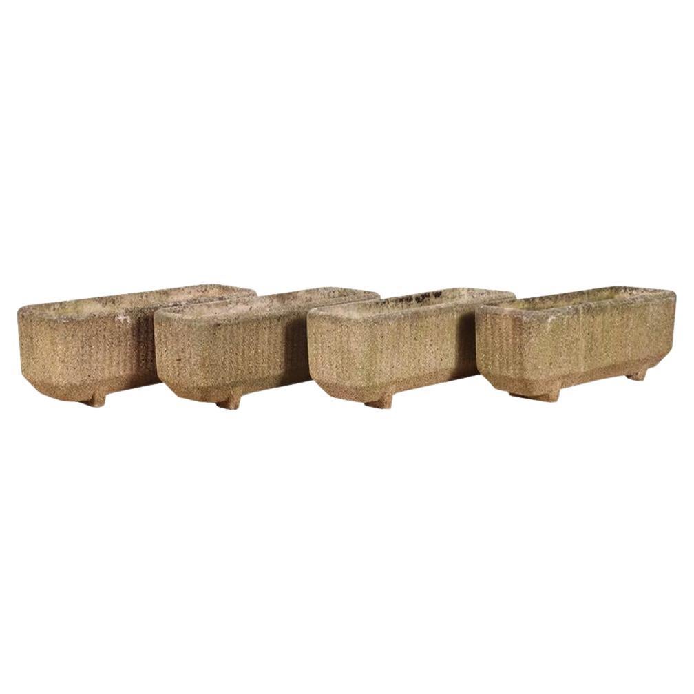 A set of Four French Modernist cast stone planters, C. 1960. For Sale