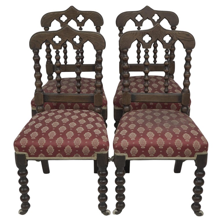 A good quality set of four Gothic Revival oak dining chairs with