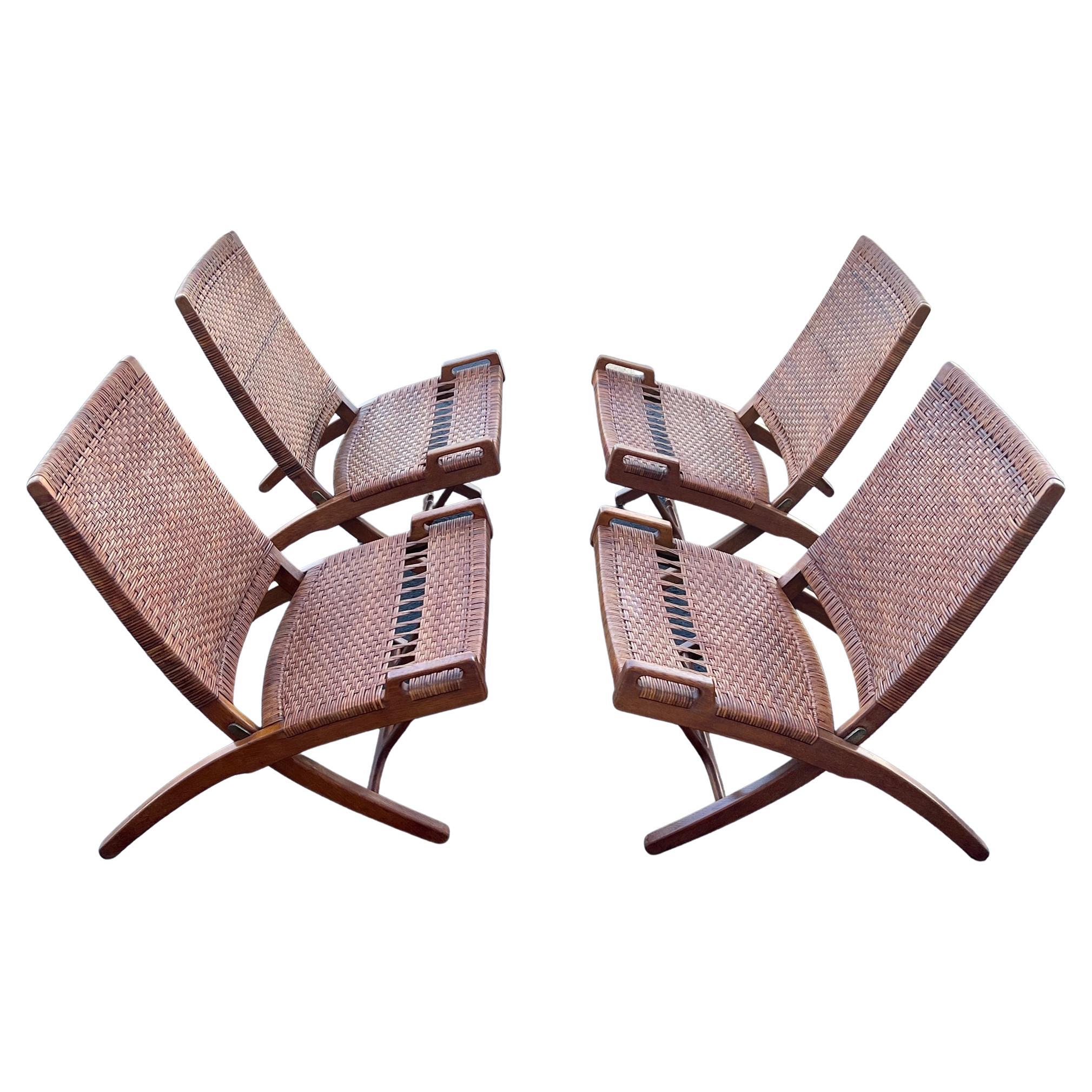 A Set Of Four Hans Wegner Folding Chairs