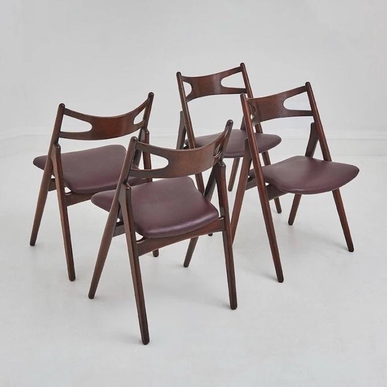 Wood A Set Of Four Hans Wegner 'Sawbuck' CH 29 Dining Chairs For Sale