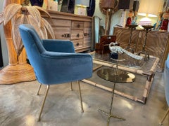 A set of four Italian 1970s chairs with gilt metal legs in blue velvet fabric