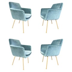 A set of four Italian 1970s chairs with gilt metal legs in blue velvet fabric
