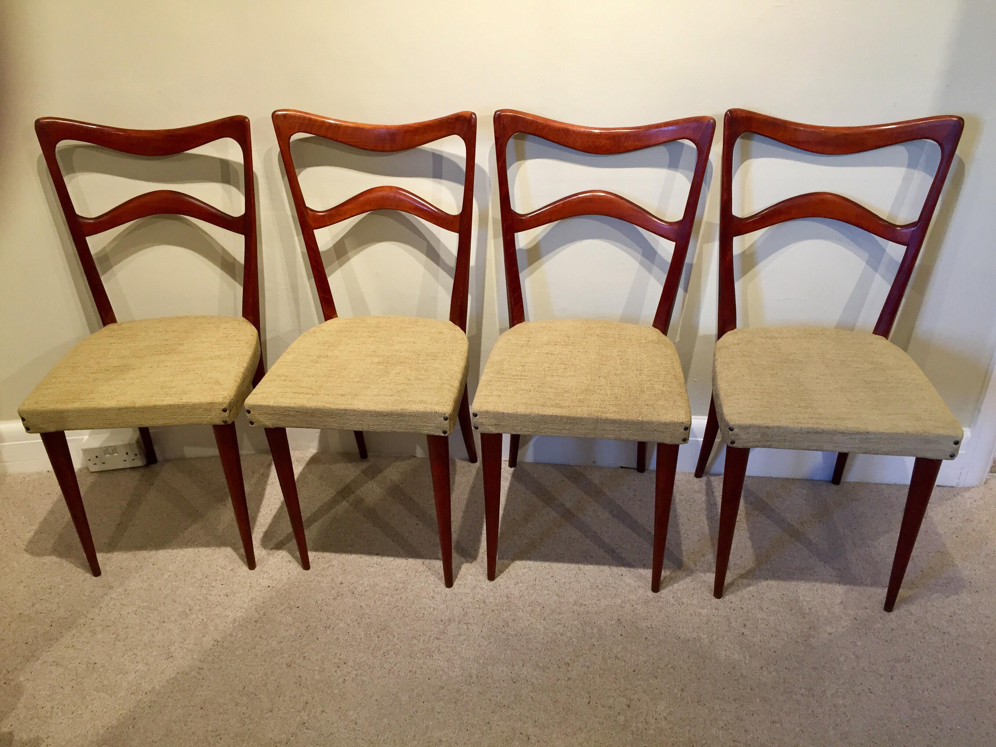 An attractive set of four Italian midcentury stained beech dining chairs by Consorzio Sedie Friuli. The most attractively shaped butterfly backs supported on slender uprights. Finished with gently tapered legs. Makers mark to each chair. True