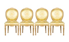 A Set of Four Italian Painted Gilt Wood Frame Louis XVI Style Dining Chairs