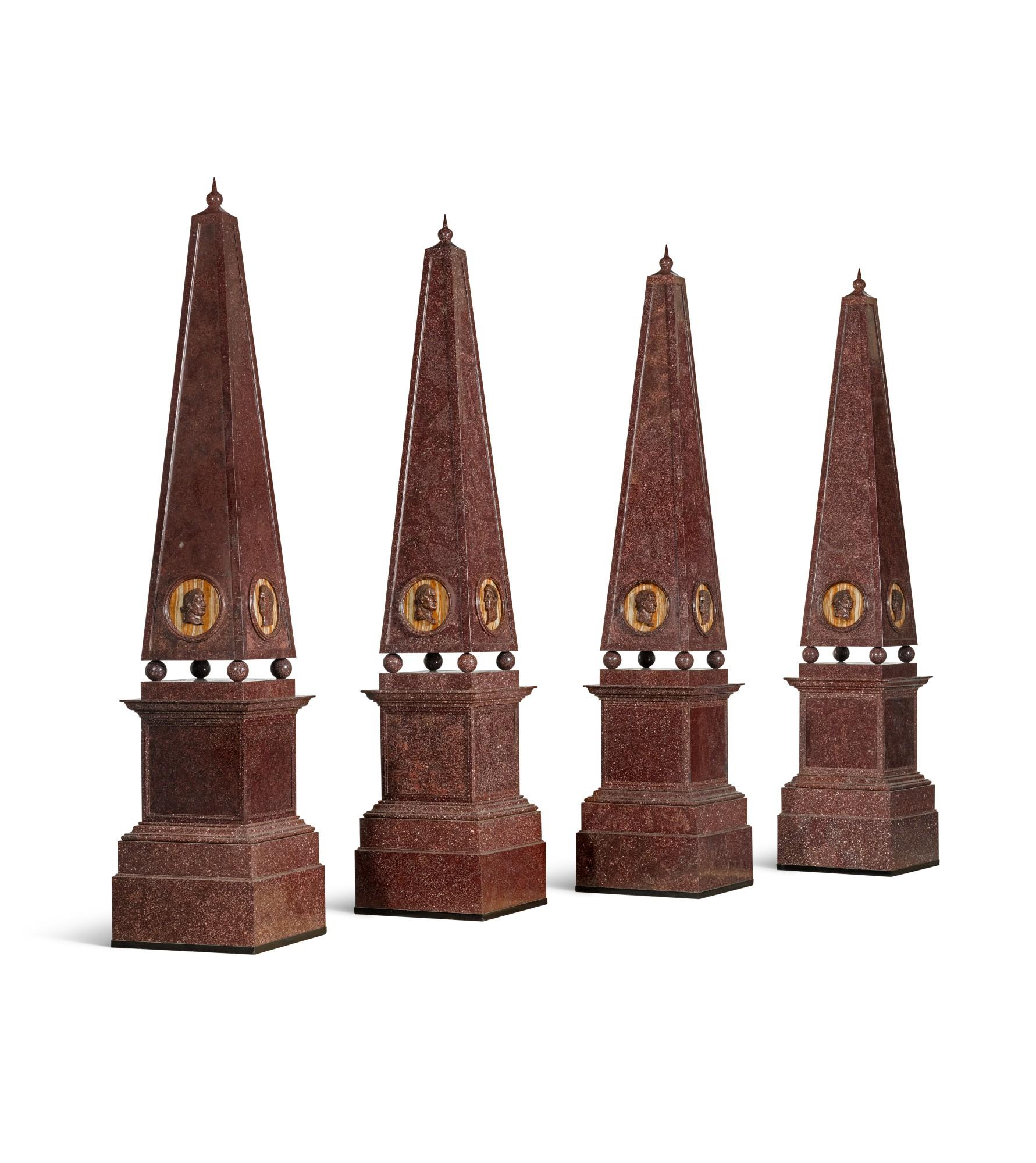 An Important Set of Four Large Porphyry Obelisks. 
 
Each obelisk is of square section tapering form with a spiked orb finial and embellished with carved roundels of the twelve Roman Emperors in profile.  The main body is raised on ball supports