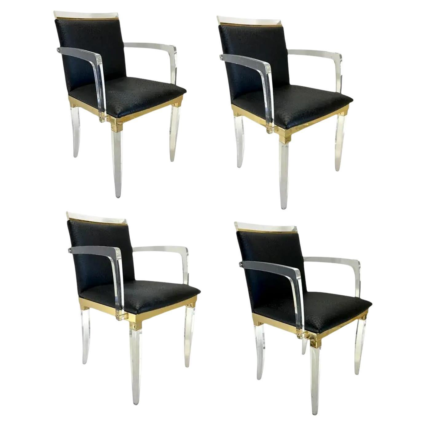 A Set of Four Lucies and Brass Arm Chairs, by Charles Hollis Jones