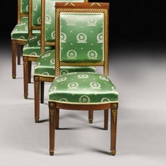 Un set di quattro sedie da salotto in stile Secondo Impero, in mogano e bronzo dorato, in M. I.