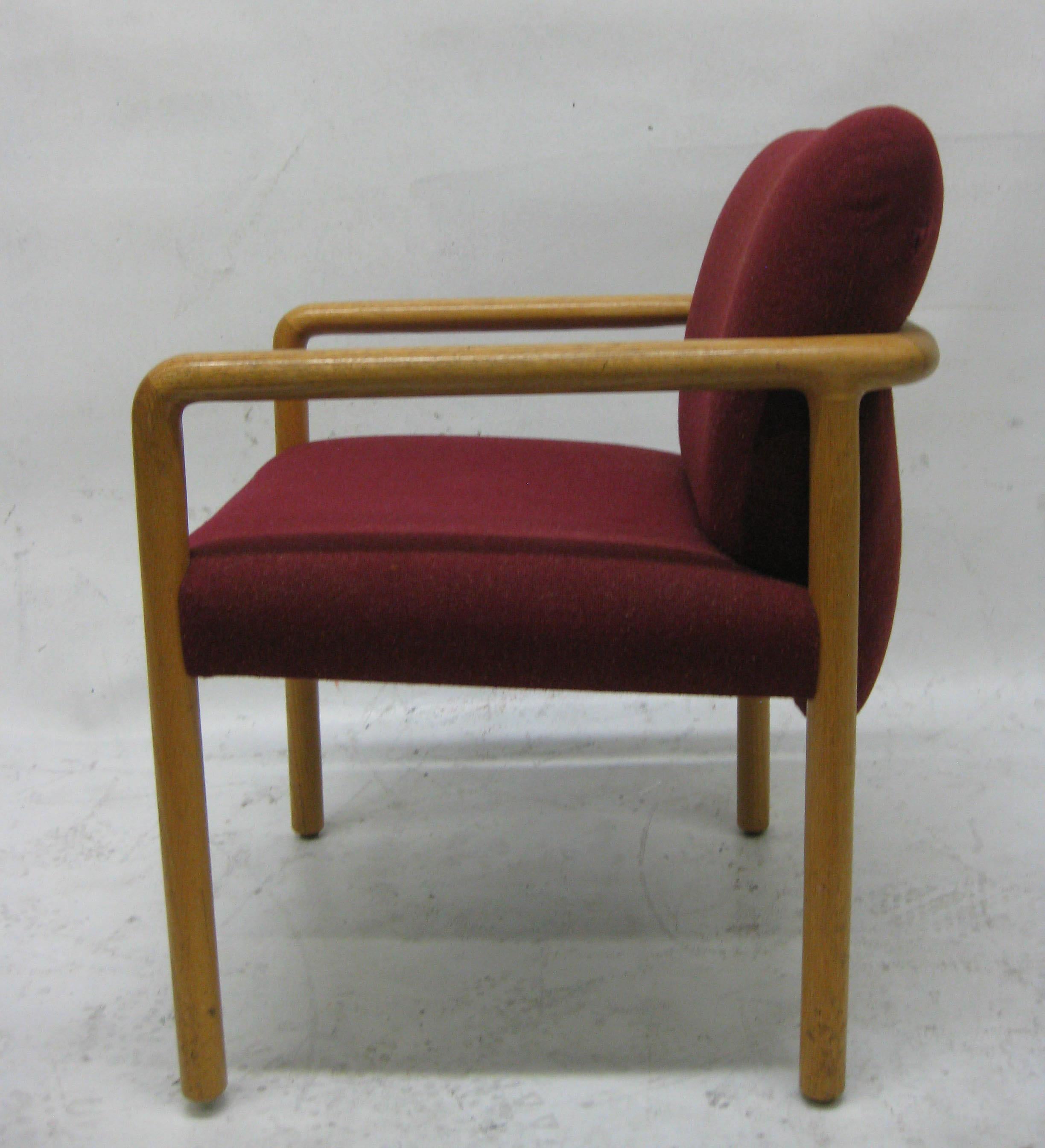 A set of 4 chairs upholstered in a plush red fabric and oak frame made by the Charlotte Company in Michigan. 
This company was started by E.J. Elles and Frank Spaulding in 1912, in Charlotte, Michigan and specialized in oak chairs.