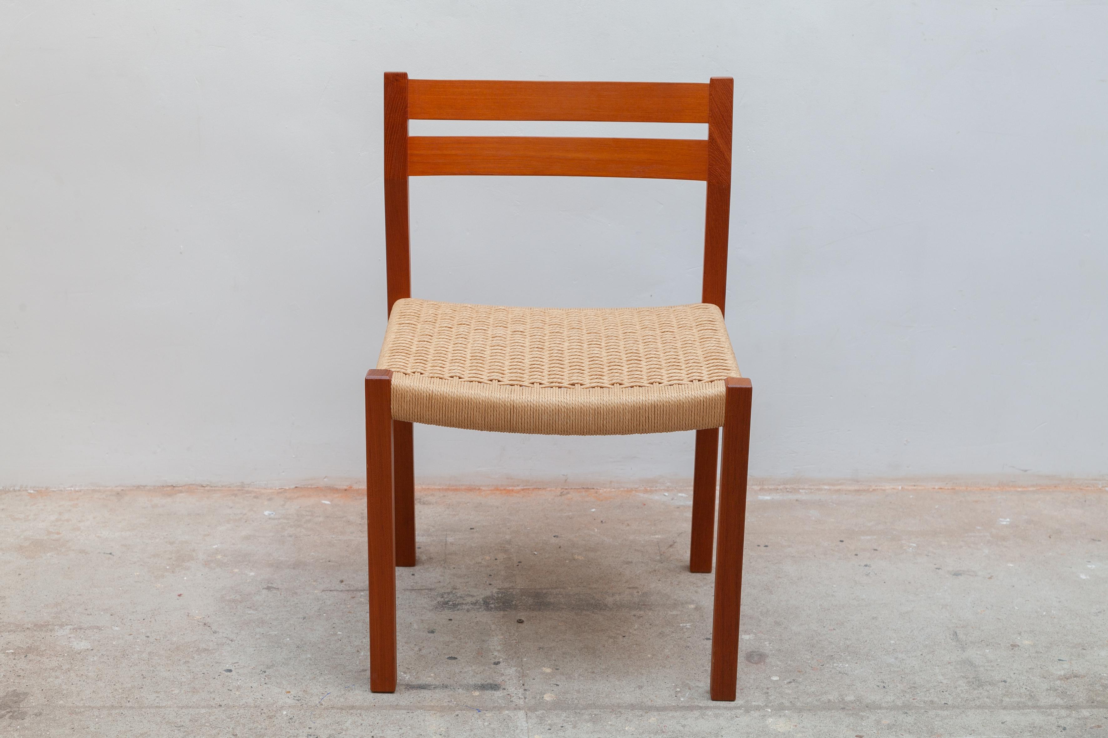 A set of four vintage teak dining chairs with cord seats. Designed by Jorgen Henrik Moller the son of the well-known Danish designer Niels O. Moller. The chairs are produced by JL Mollers Møbelfabrik from Denmark. The sleek frame is made of teak and