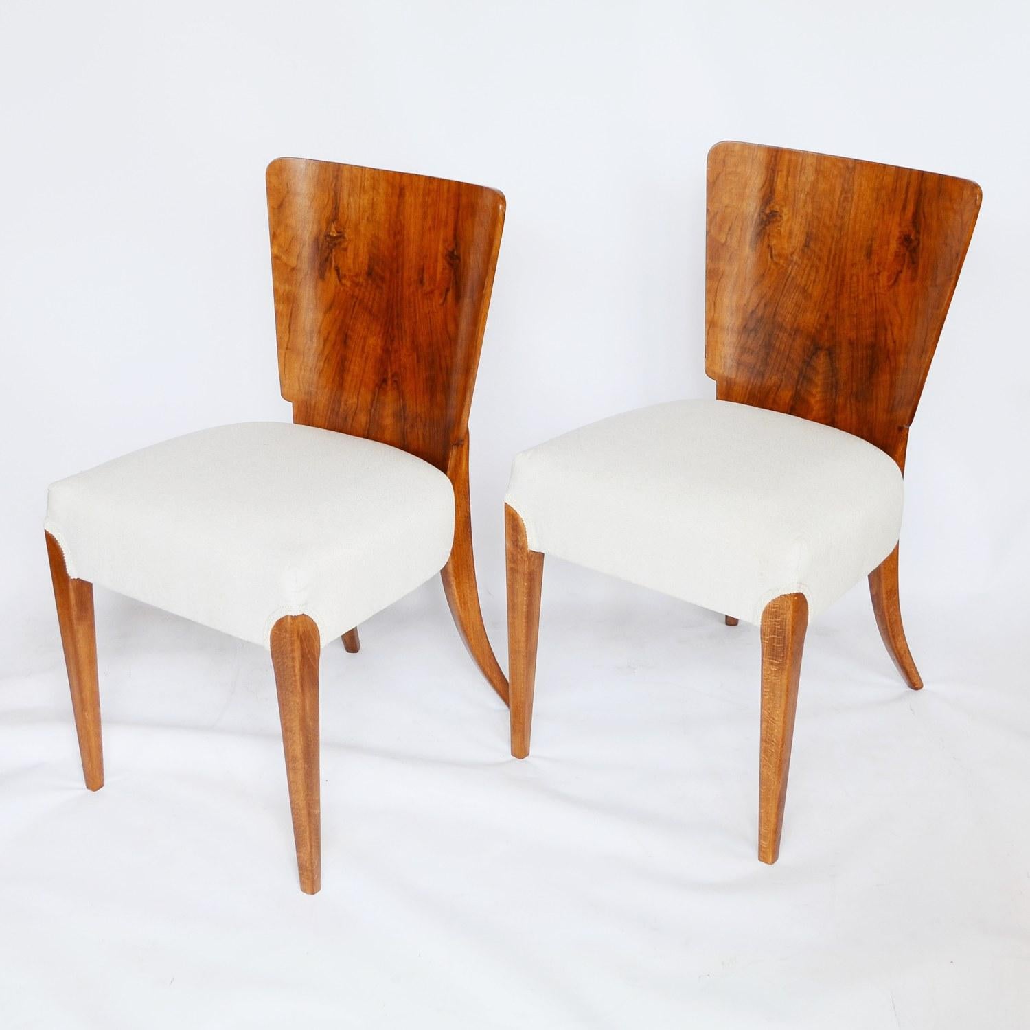 set of four dining chairs by Jindrich Halabala. Walnut veneered with solid walnut tapered legs. Re-upholstered in cream linen. 

Origin: Czech Republic 

Date: circa 1950

Item Number: 1410202

All of our furniture is extensively polished