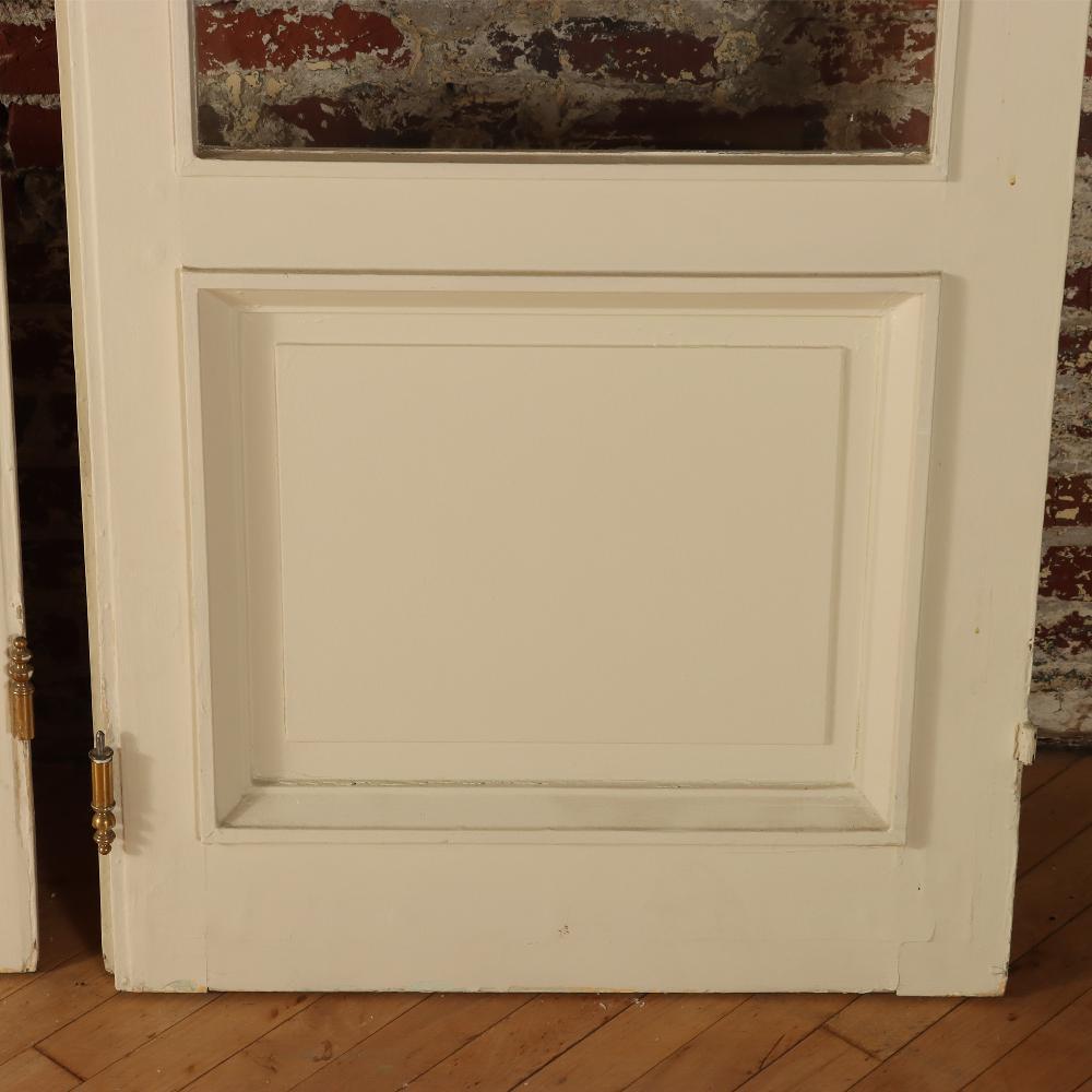 Wood A set of four panel French entry doors circa 1900.