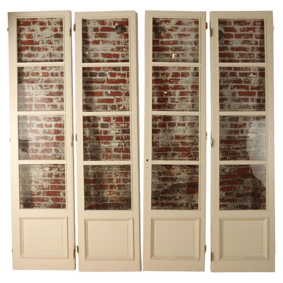 A set of four panel French entry doors circa 1900.