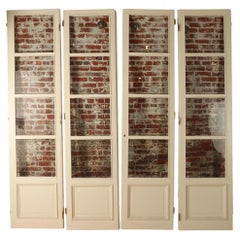 A set of four panel French entry doors circa 1900.