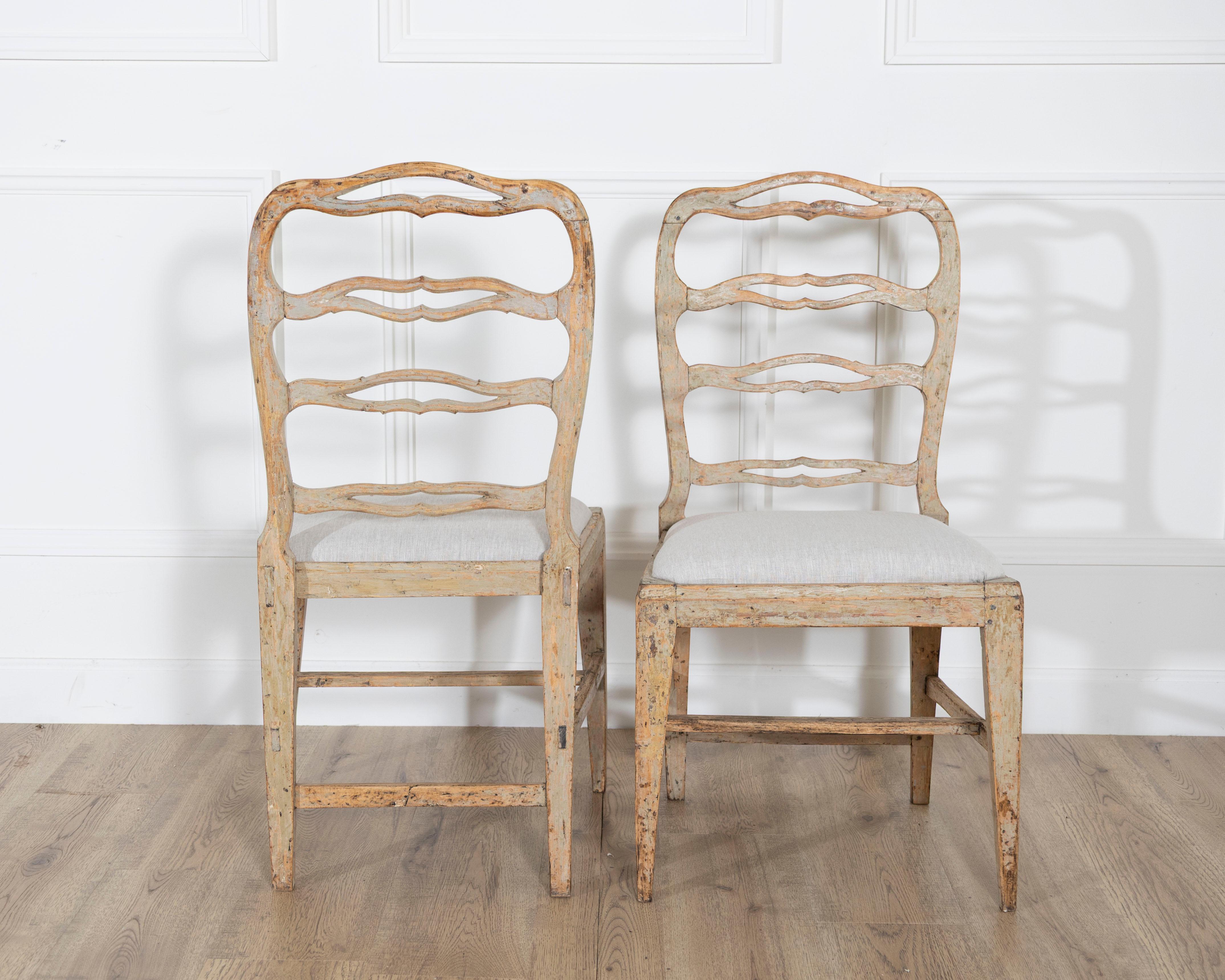 A set of four period Gustavian chairs scraped to original paint and newly covere In Good Condition For Sale In Atlanta, GA