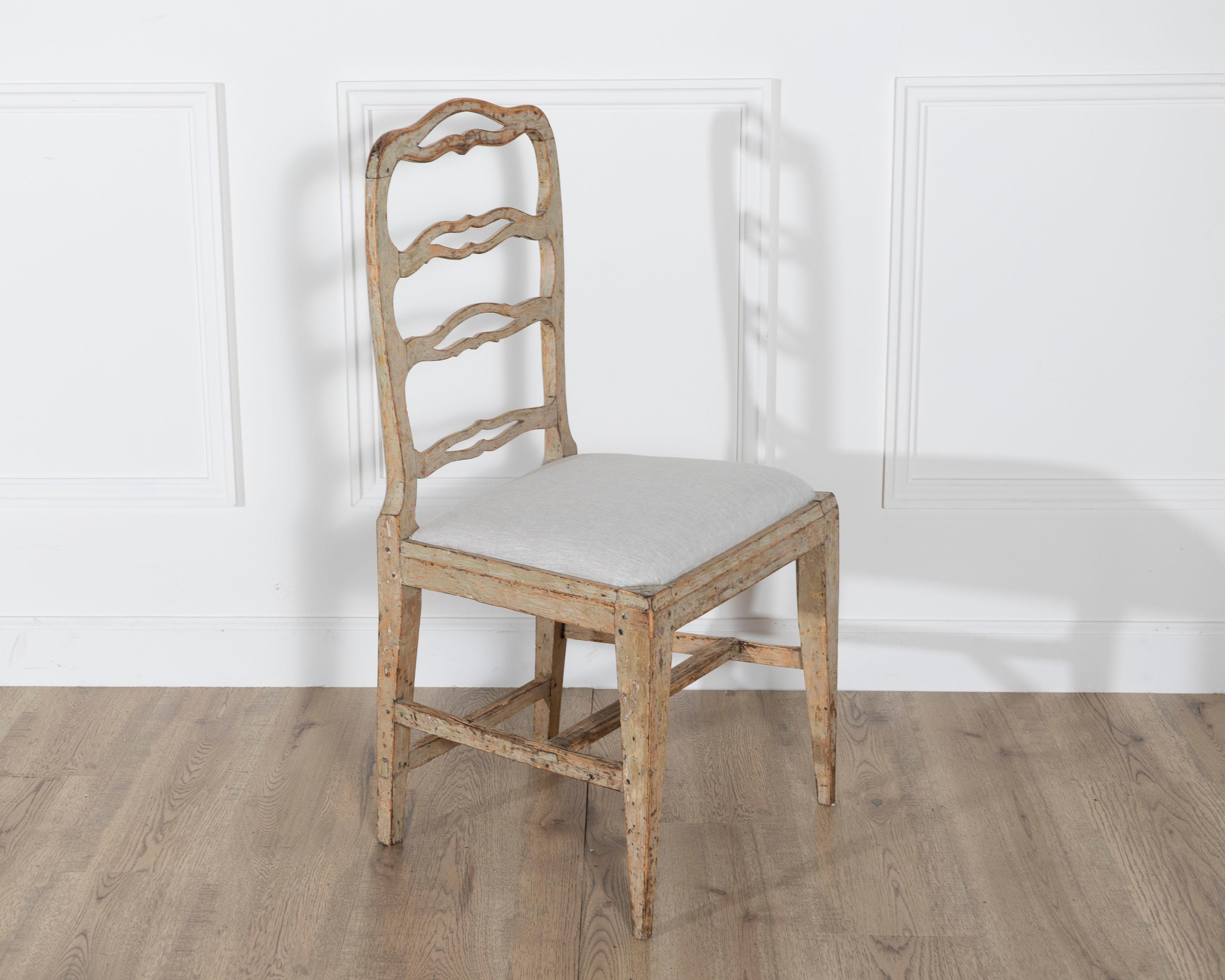 A set of four period Gustavian chairs scraped to original paint and newly covere For Sale 1