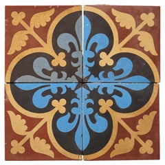 A Set Of Four Reclaimed Encaustic Floral Quatrefoil Tiles