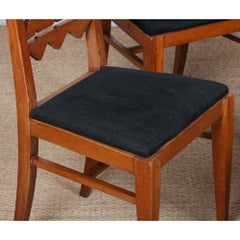 A set of four solid oak chairs from the 1950s