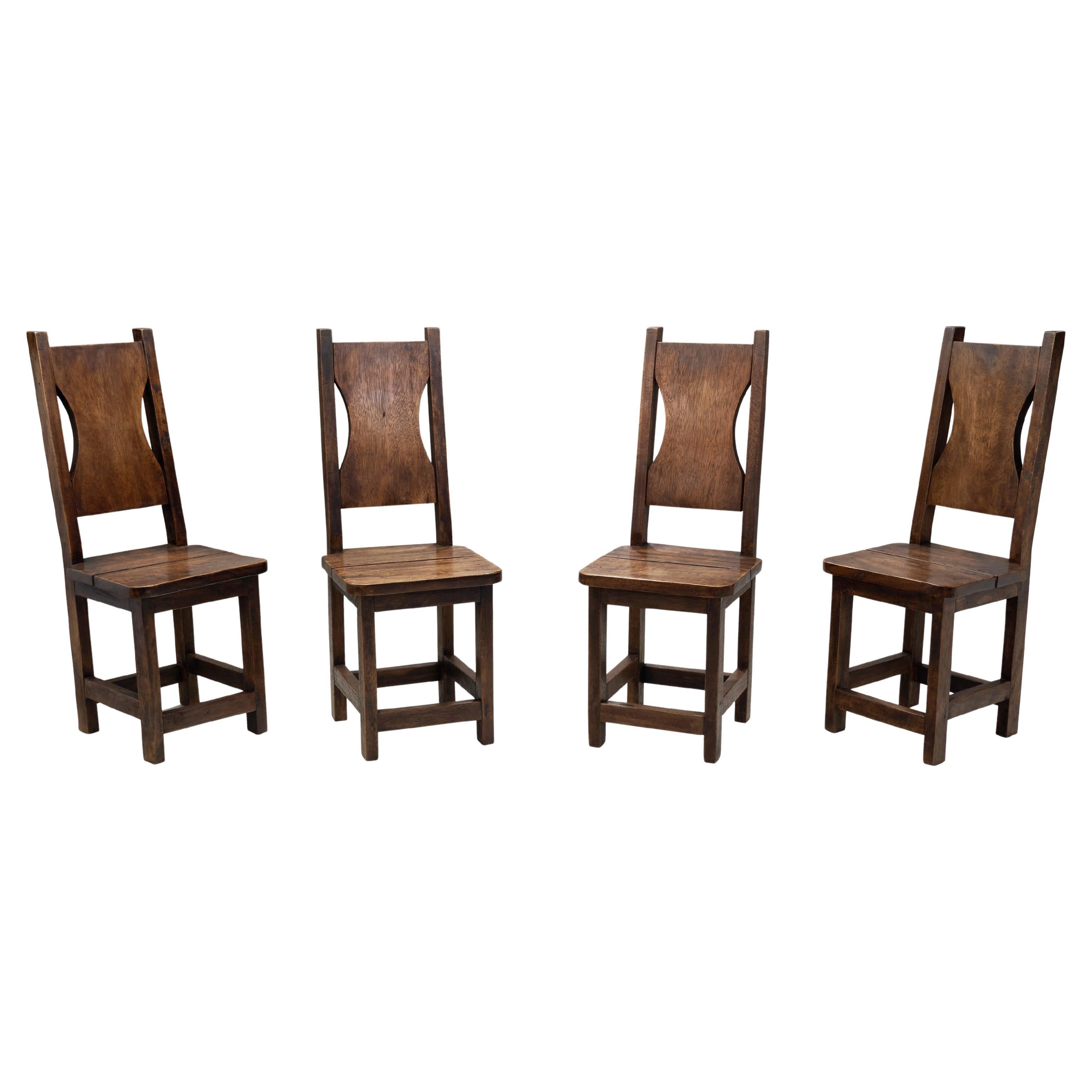 A Set of Four Stained Beech Modernist Dining Chairs, France 1950s