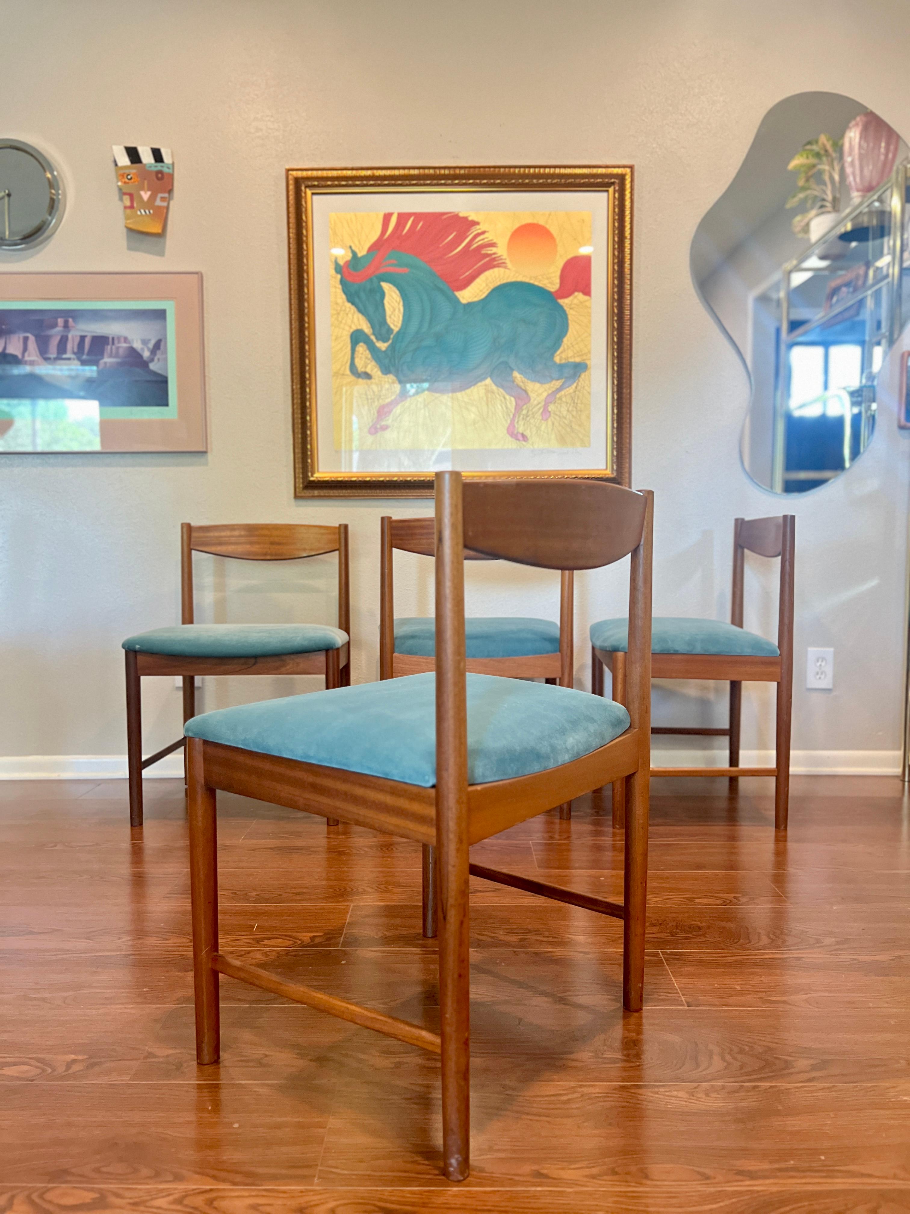 A set of four teak dining chairs by Tom Robertson for A.H McIntosh blue velvet 2