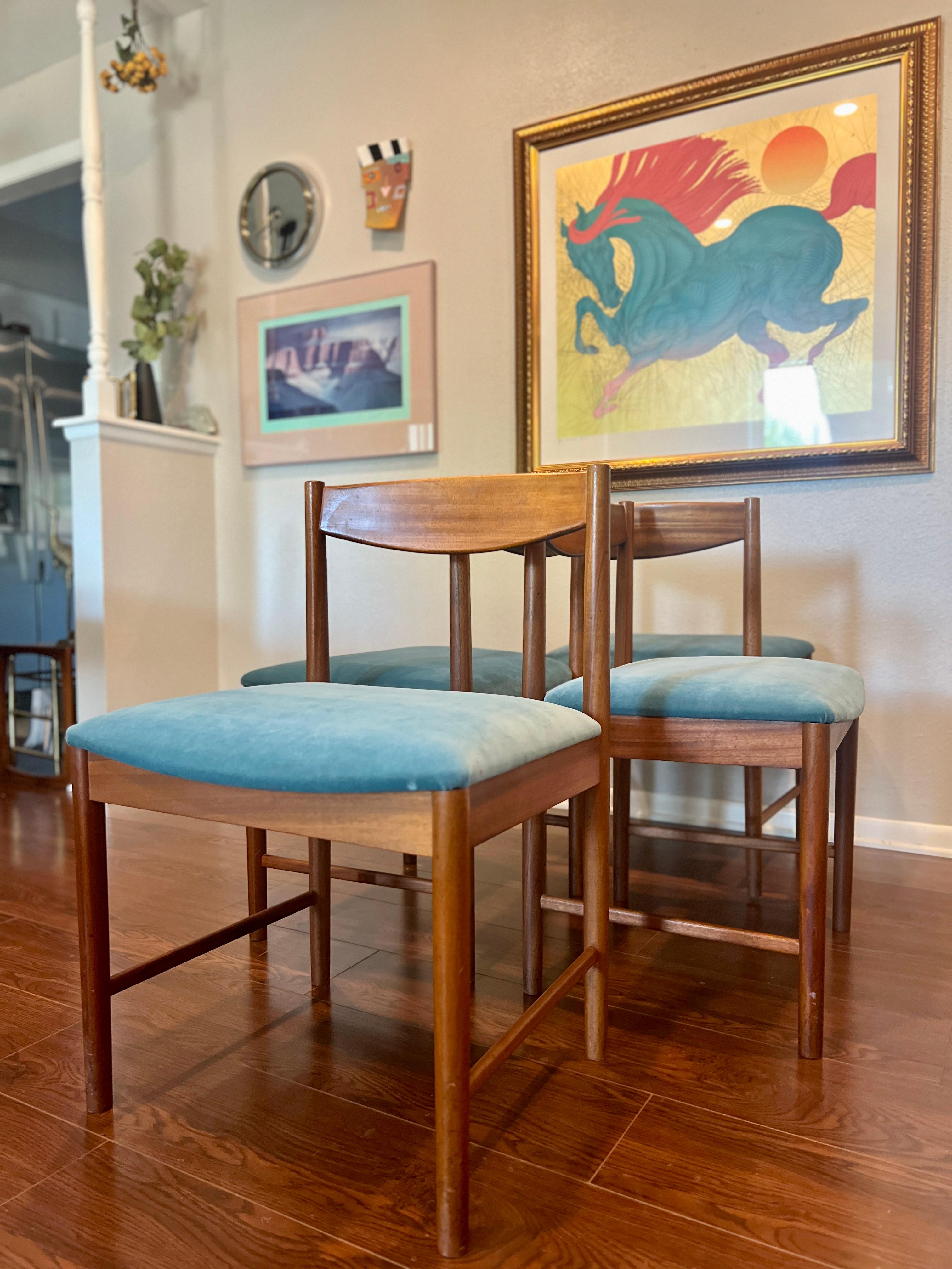 A set of four teak dining chairs by Tom Robertson for A.H McIntosh blue velvet 5