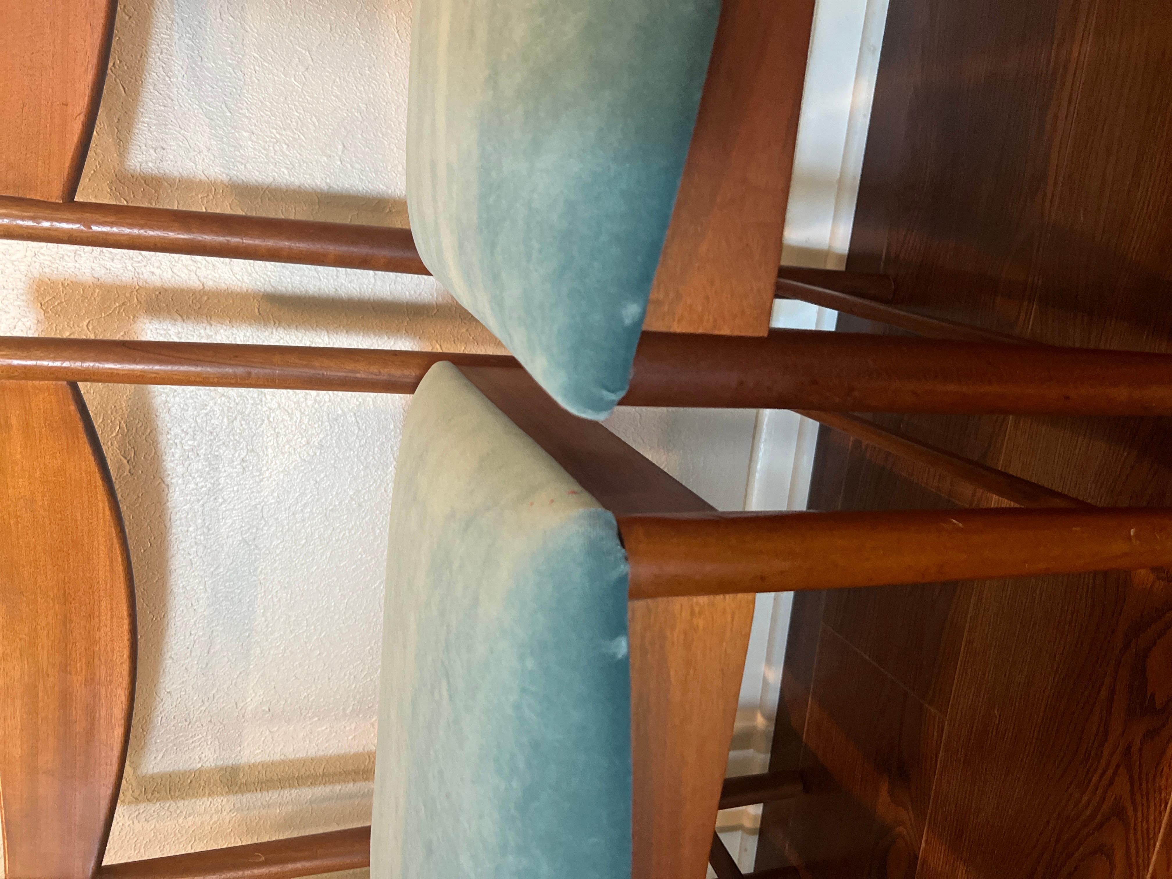 A set of four teak dining chairs by Tom Robertson for A.H McIntosh blue velvet 8