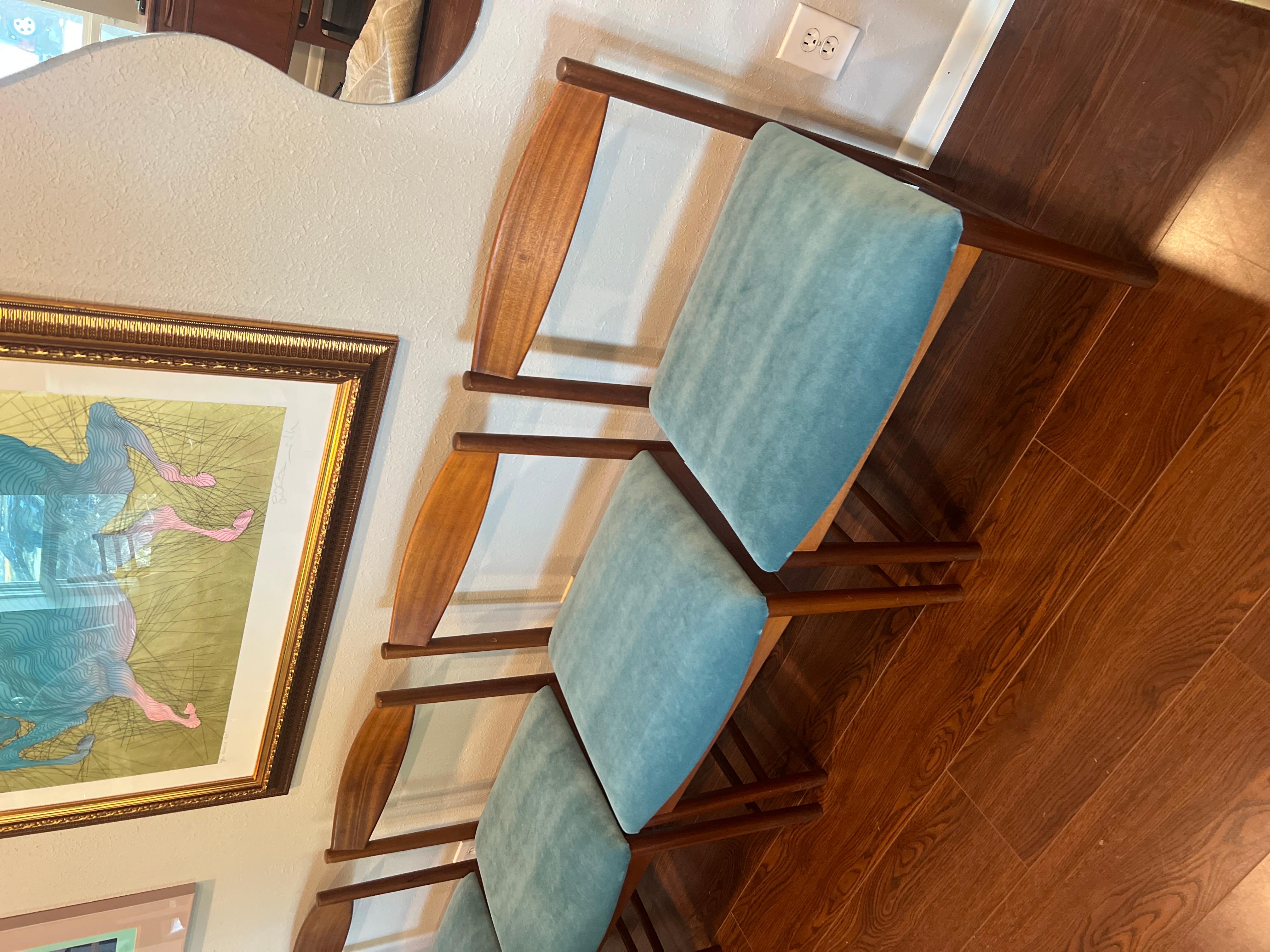 A set of four teak dining chairs by Tom Robertson for A.H McIntosh blue velvet 9