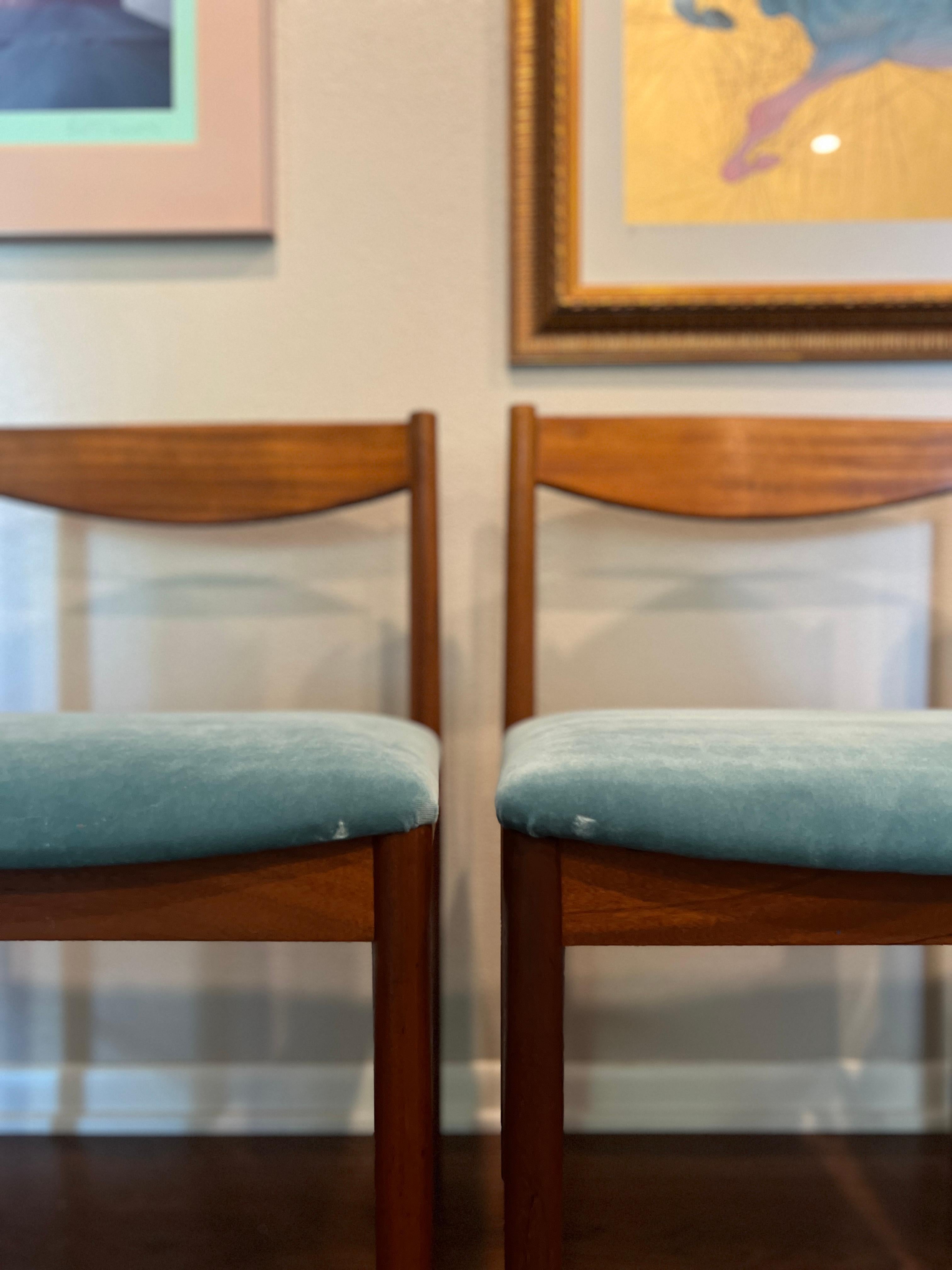 European A set of four teak dining chairs by Tom Robertson for A.H McIntosh blue velvet