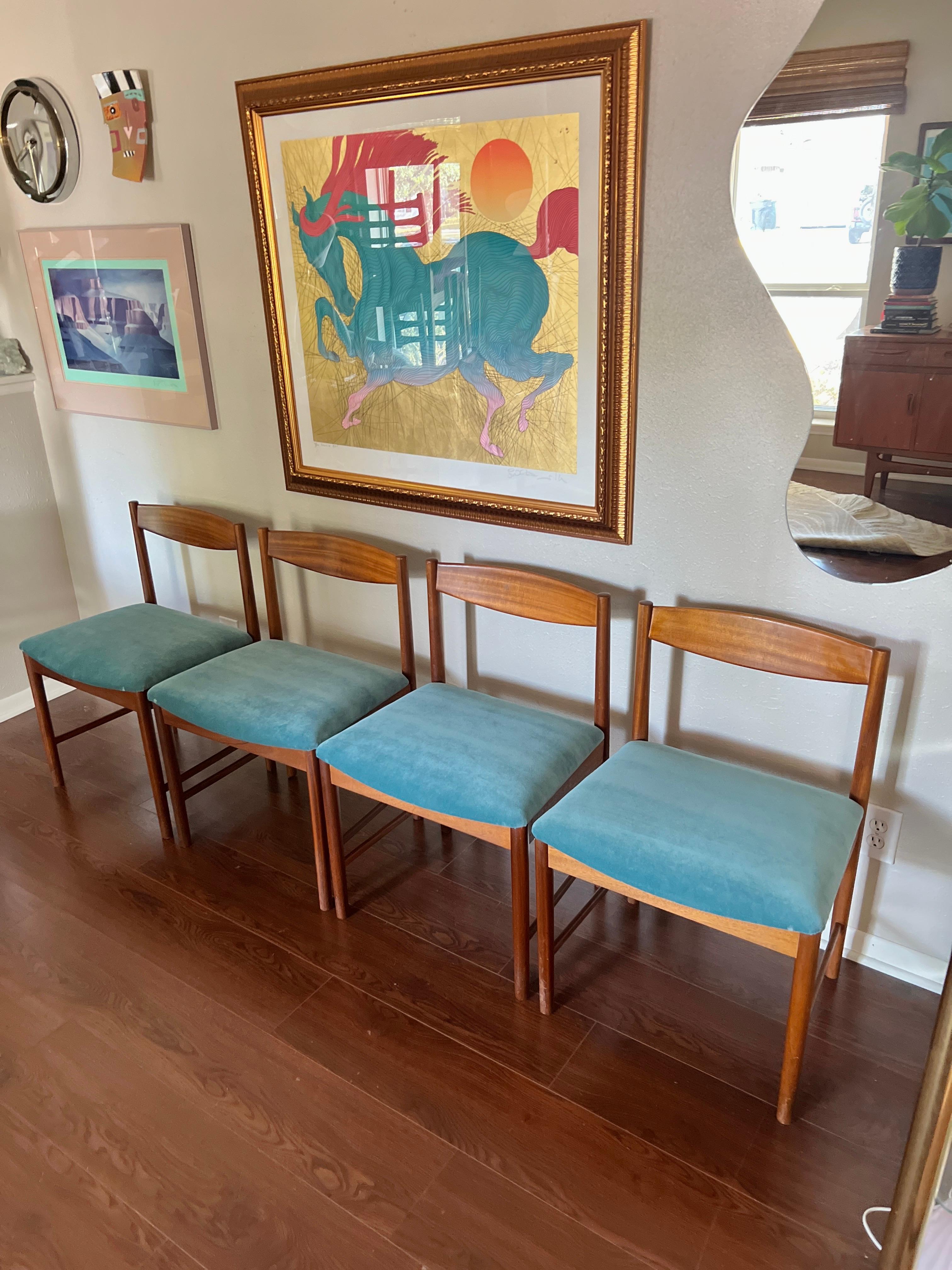 A set of four teak dining chairs by Tom Robertson for A.H McIntosh blue velvet In Good Condition In Houston, TX