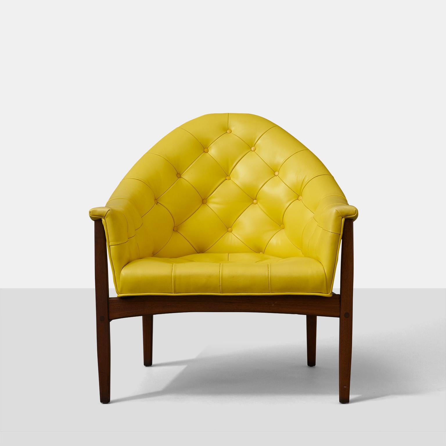 A set of four tufted lounge chairs by Milo Baughman for Thayer Coggin. Walnut frames and buttercup yellow upholstery. A rare early entry in Baughman and Coggin's three decade colaboration. Price is per set of 2.