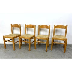 Ensemble de quatre chaises de salle à manger vintage à siège en jonc