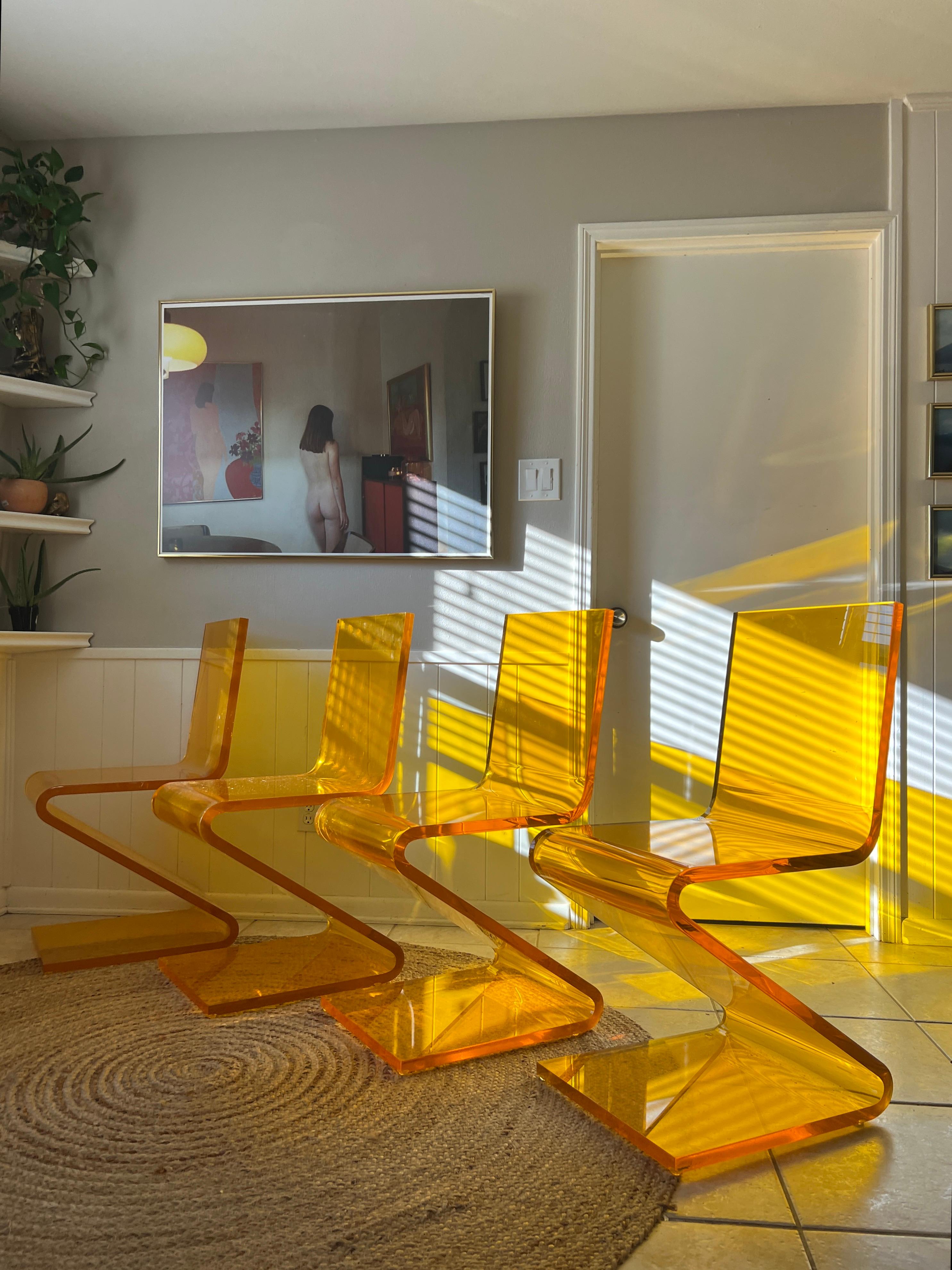 A set of four Z chairs by Haziza in a 1” thick lucite orange color For Sale 2